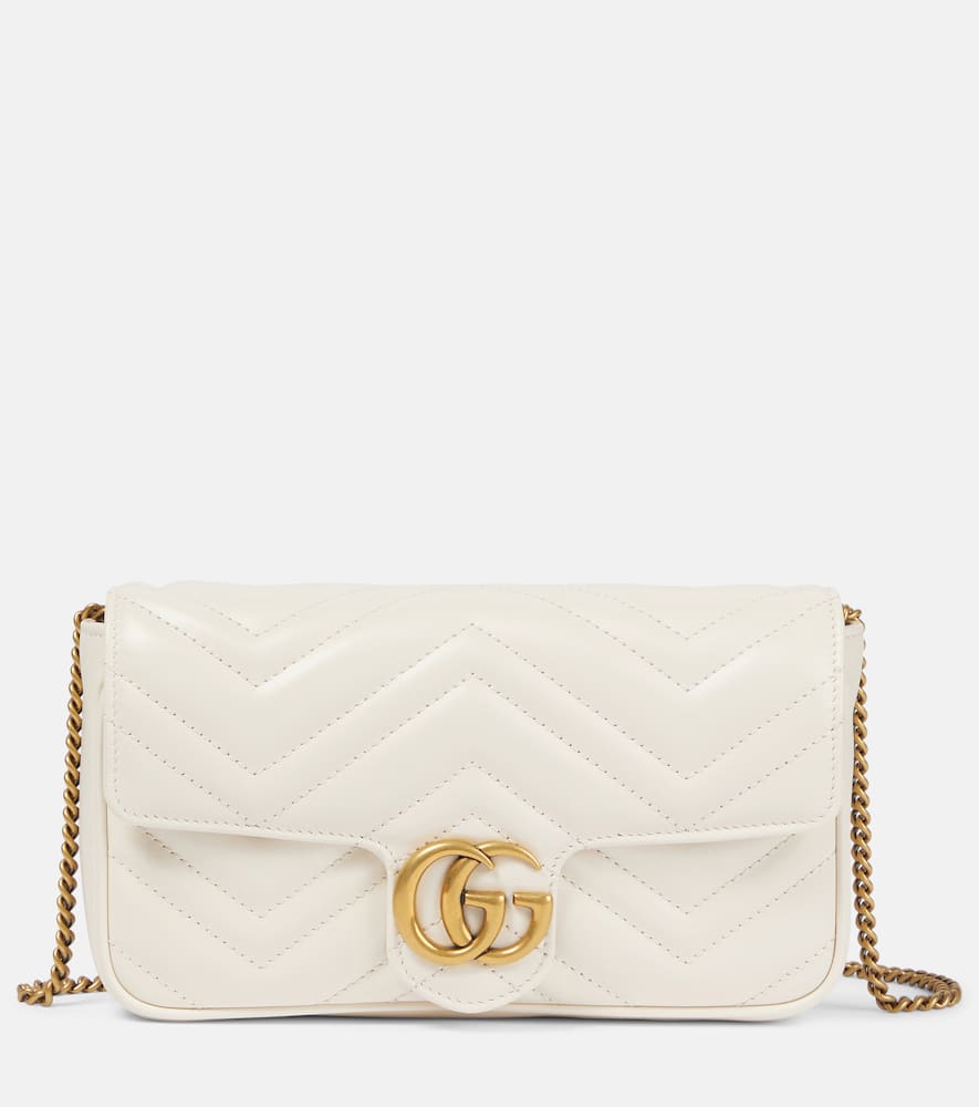 Gucci GG Marmont leather wallet on chain. Shop Gucci Shoulder Bags for women now.