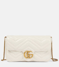Gucci GG Marmont leather wallet on chain. Shop Gucci Shoulder Bags for women now.