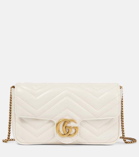 Gucci GG Marmont leather wallet on chain. Shop Gucci Shoulder Bags for women now.