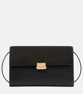 The Row Laurie suede and leather crossbody bag. Shop The Row Shoulder Bags for women now.