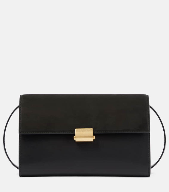 The Row Laurie suede and leather crossbody bag. Shop The Row Shoulder Bags for women now.