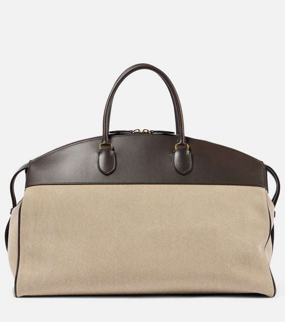 The Row George XL leather-trimmed denim duffel bag. Shop The Row Tote Bags for women now.