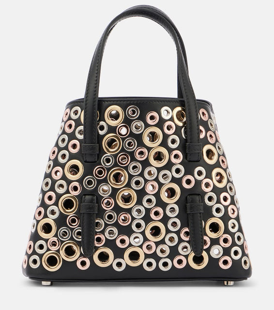 Alaia Mina 20 embellished leather tote bag. Shop Alaia Top-Handle Bags for women now.