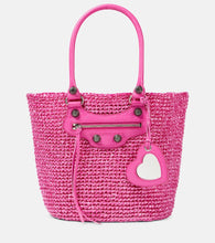 Balenciaga Le Cagole Medium raffia tote bag. Shop Balenciaga Tote Bags for women now.