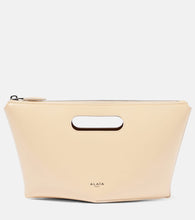 Alaia Folded Mini leather clutch. Shop Alaia Top-Handle Bags for women now.