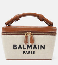 Balmain B-Army leather-trimmed canvas makeup bag. Shop Balmain Top-Handle Bags for women now.