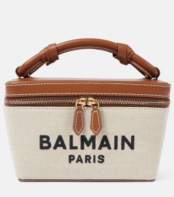 Balmain B-Army leather-trimmed canvas makeup bag. Shop Balmain Top-Handle Bags for women now.