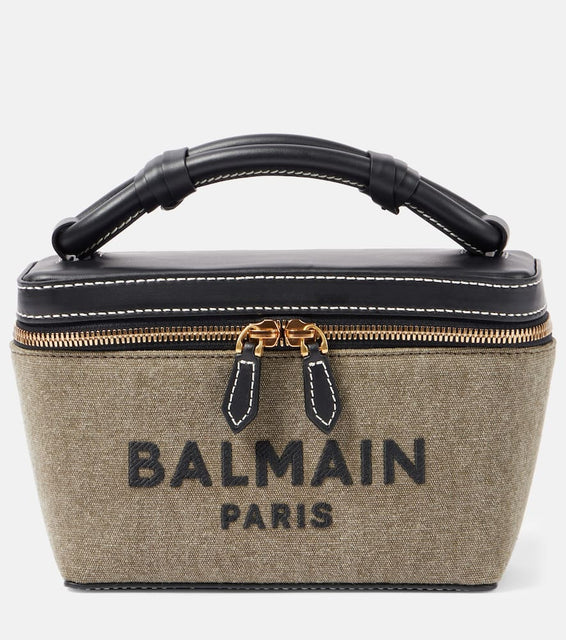 Balmain B-Army leather-trimmed canvas shoulder bag. Shop Balmain Top-Handle Bags for women now.