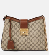 Gucci Padlock Medium GG Canvas shoulder bag. Shop Gucci Shoulder Bags for women now.
