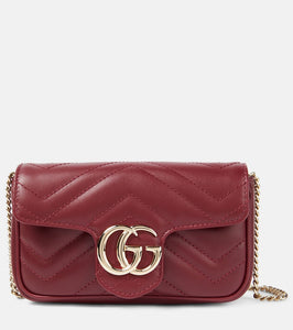 Gucci GG Marmont Super Mini leather shoulder bag. Shop Gucci Clutches for women now.