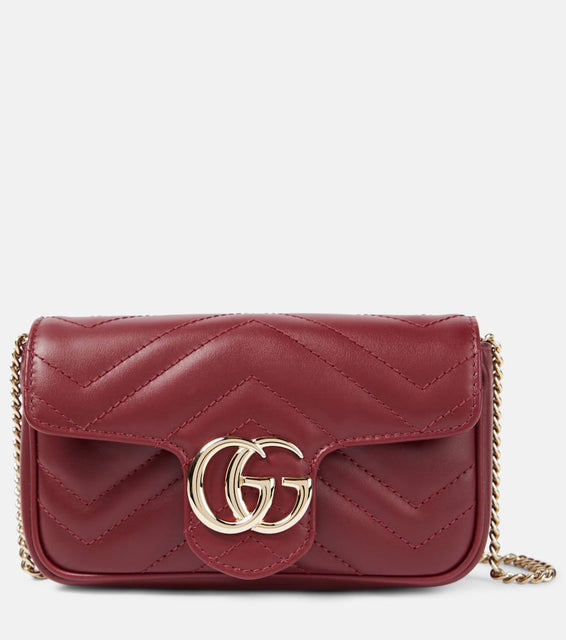 Gucci GG Marmont Super Mini leather shoulder bag. Shop Gucci Clutches for women now.