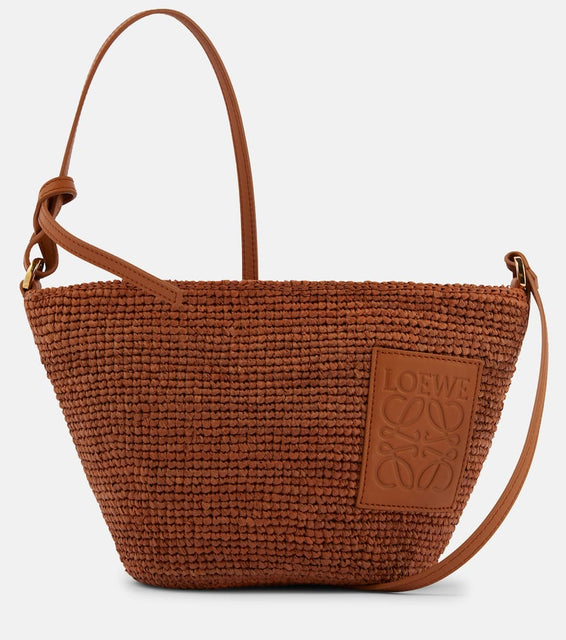 Loewe Slit Small raffia basket bag. Shop Loewe Crossbody Bags for women now.