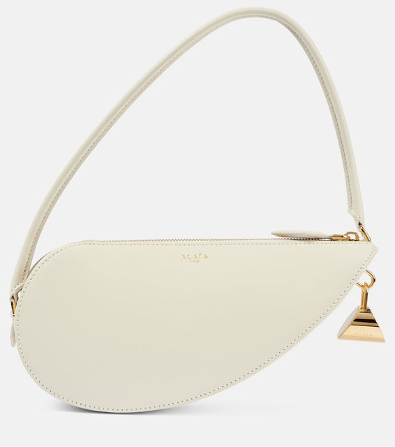 Alaia Le Demi C√Ö¬ìur leather shoulder bag. Shop Alaia Shoulder Bags for women now.