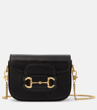 Gucci Gucci Horsebit 1955 Mini leather shoulder bag. Shop Gucci Crossbody Bags for women now.