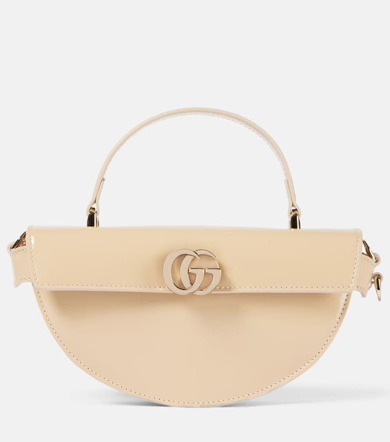 Gucci Half Moon Small leather shoulder bag. Shop Gucci Top-Handle Bags for women now.