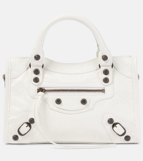 Balenciaga Le City Mini leather shoulder bag. Shop Balenciaga Top-Handle Bags for women now.