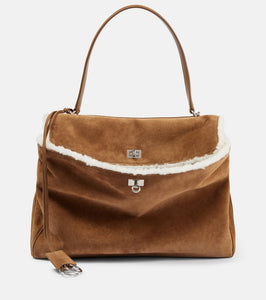 Balenciaga Rodeo Large shearling-lined suede shoulder bag. Shop Balenciaga Shoulder Bags for women now.