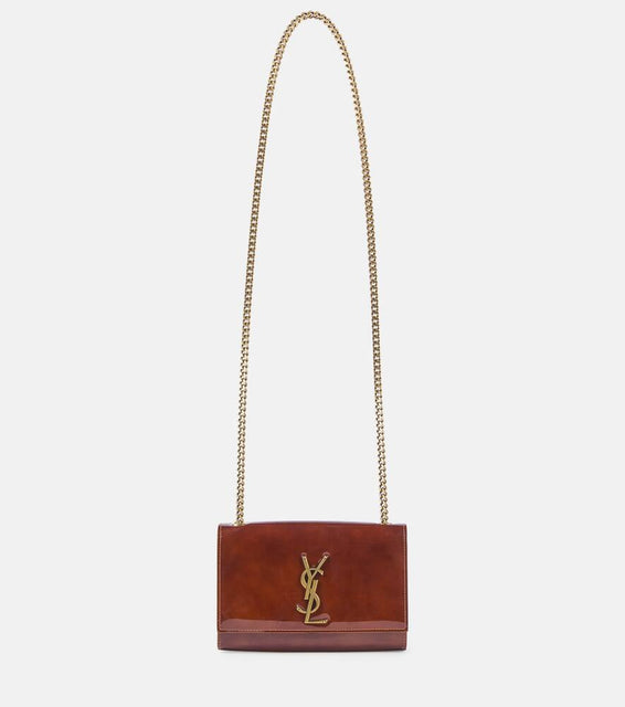 Saint Laurent Kate Small patent leather wallet on chain. Shop Saint Laurent Crossbody Bags for women now.