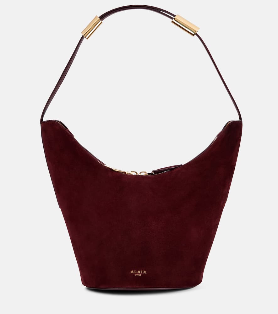 Alaia Shape Small suede and leather bucket bag. Shop Alaia Shoulder Bags for women now.