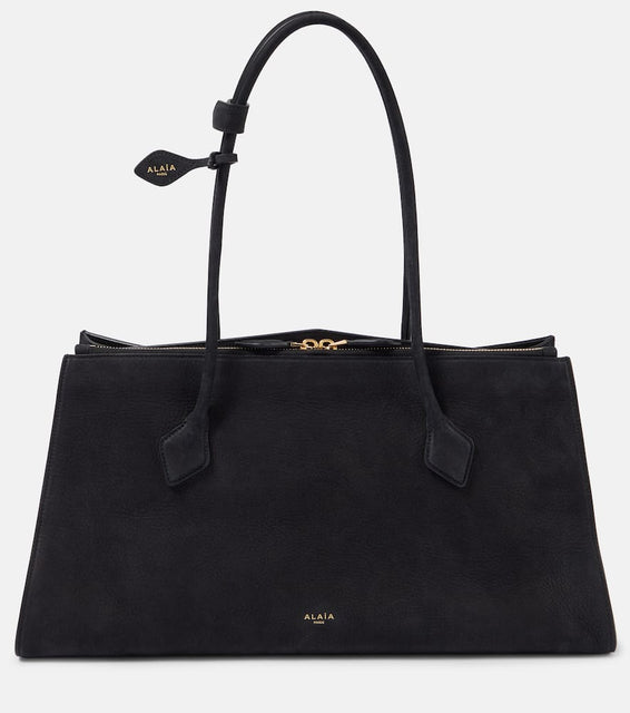 Alaia Le Teckel leather tote bag. Shop Alaia Tote Bags for women now.