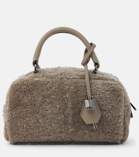 Brunello Cucinelli Leather-trimmed shearling tote bag. Shop Brunello Cucinelli Top-Handle Bags for women now.