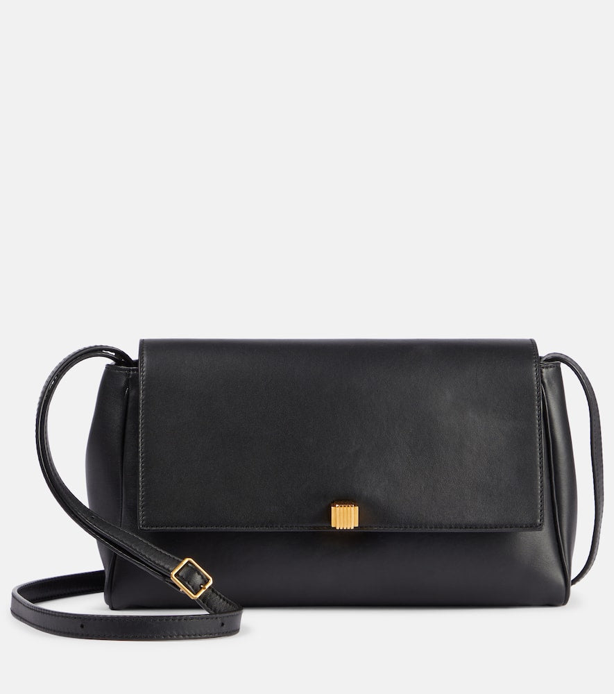 Khaite Cate leather clutch. Shop Khaite Crossbody Bags for women now.