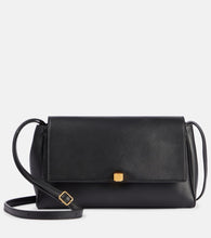 Khaite Cate leather clutch. Shop Khaite Crossbody Bags for women now.