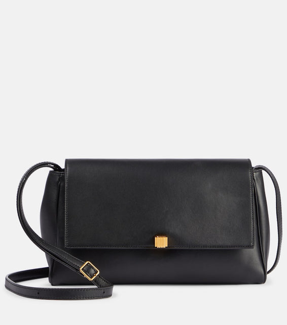 Khaite Cate leather clutch. Shop Khaite Crossbody Bags for women now.