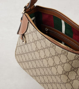 Gucci GG Canvas Medium leather-trimmed shoulder bag