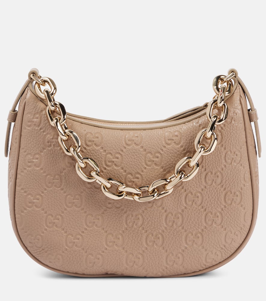 Gucci GG Emblem Small leather shoulder bag. Shop Gucci Top-Handle Bags for women now.