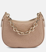 Gucci GG Emblem Small leather shoulder bag. Shop Gucci Top-Handle Bags for women now.