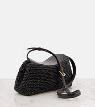 Toteme T-Lock woven leather clutch