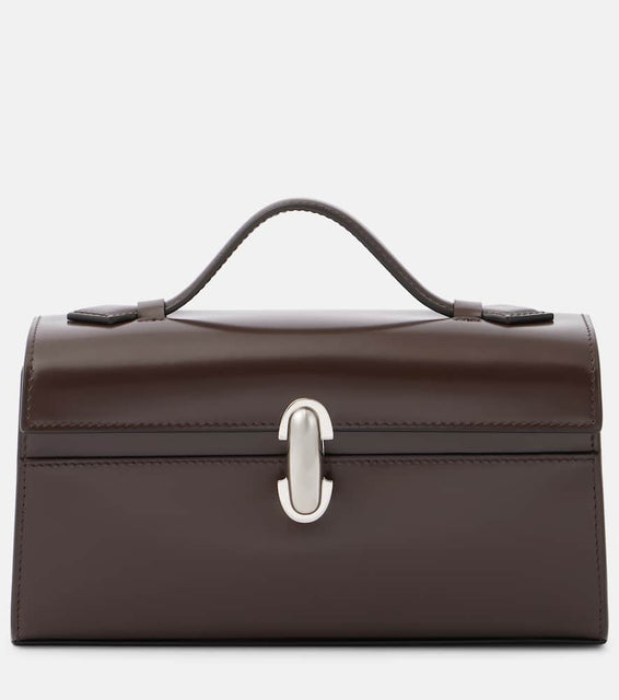 Savette Symmetry Pochette leather tote bag. Shop Savette Top-Handle Bags for women now.