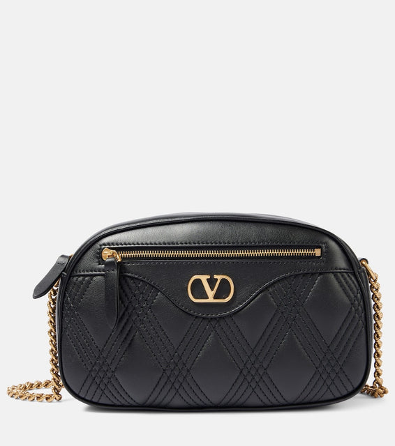 Valentino Garavani Quiltie 67 Small leather shoulder bag. Shop Valentino Garavani Crossbody Bags for women now.