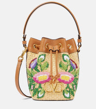 Valentino Garavani VLogo floral embroidered bucket bag. Shop Valentino Garavani Bucket Bags for women now.