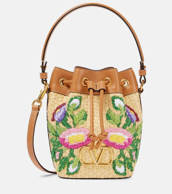Valentino Garavani VLogo floral embroidered bucket bag. Shop Valentino Garavani Bucket Bags for women now.