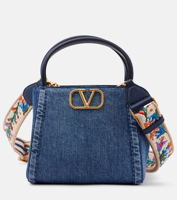 Valentino Garavani Alltime Small denim tote bag. Shop Valentino Garavani Top-Handle Bags for women now.
