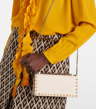 Valentino Garavani Rockstud leather wallet on chain