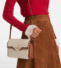 Valentino Garavani Rockstud Small shearling shoulder bag