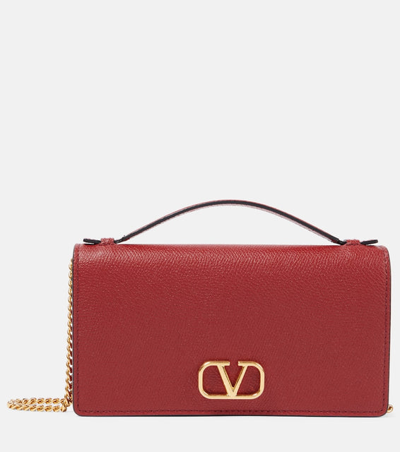 Valentino Garavani VLogo Small leather crossbody bag. Shop Valentino Garavani Top-Handle Bags for women now.