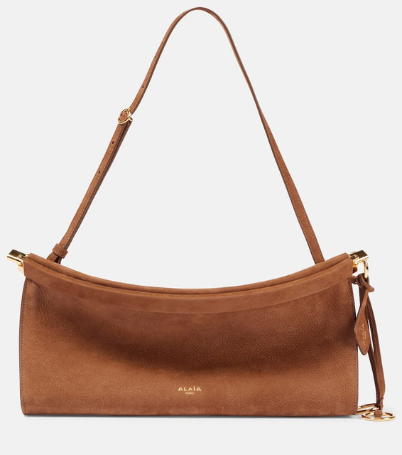 Alaia Le Click East West Medium leather shoulder bag. Shop Alaia Shoulder Bags for women now.