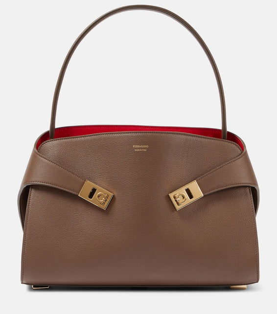 Ferragamo Hug Medium leather shoulder bag. Shop Ferragamo Top-Handle Bags for women now.