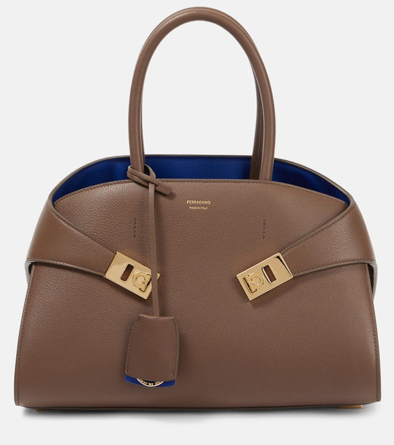 Ferragamo Hug Medium leather tote bag. Shop Ferragamo Top-Handle Bags for women now.