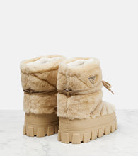 Prada Shearling and leather snow boots
