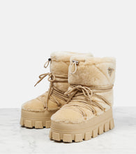 Prada Shearling and leather snow boots