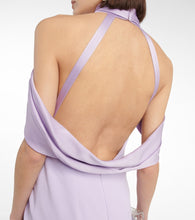 Safiyaa Louella  and satin halterneck gown
