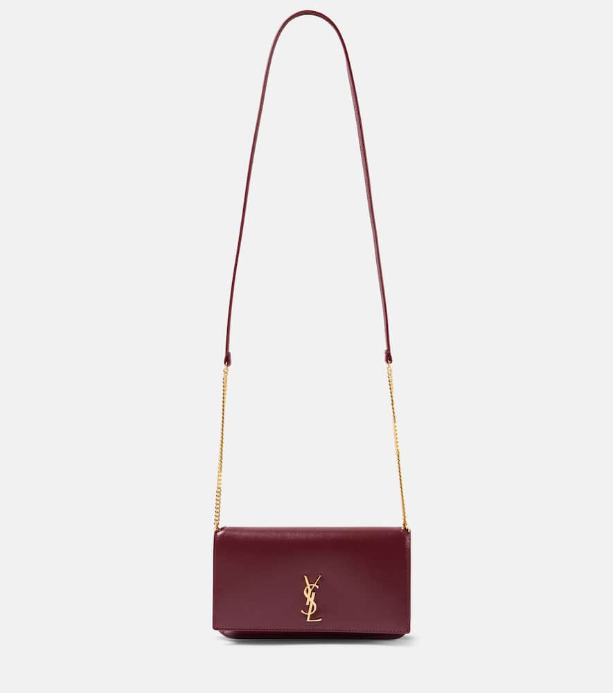 Saint Laurent Cassandre leather phone pouch. Shop Saint Laurent Crossbody Bags for women now.