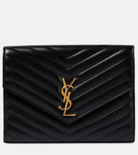Saint Laurent Cassandre matelass√É¬© leather clutch. Shop Saint Laurent Clutches for women now.