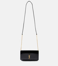 Saint Laurent Cassandre patent leather phone pouch. Shop Saint Laurent Crossbody Bags for women now.