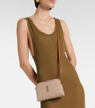 Saint Laurent Gaby leather-trimmed canvas crossbody bag